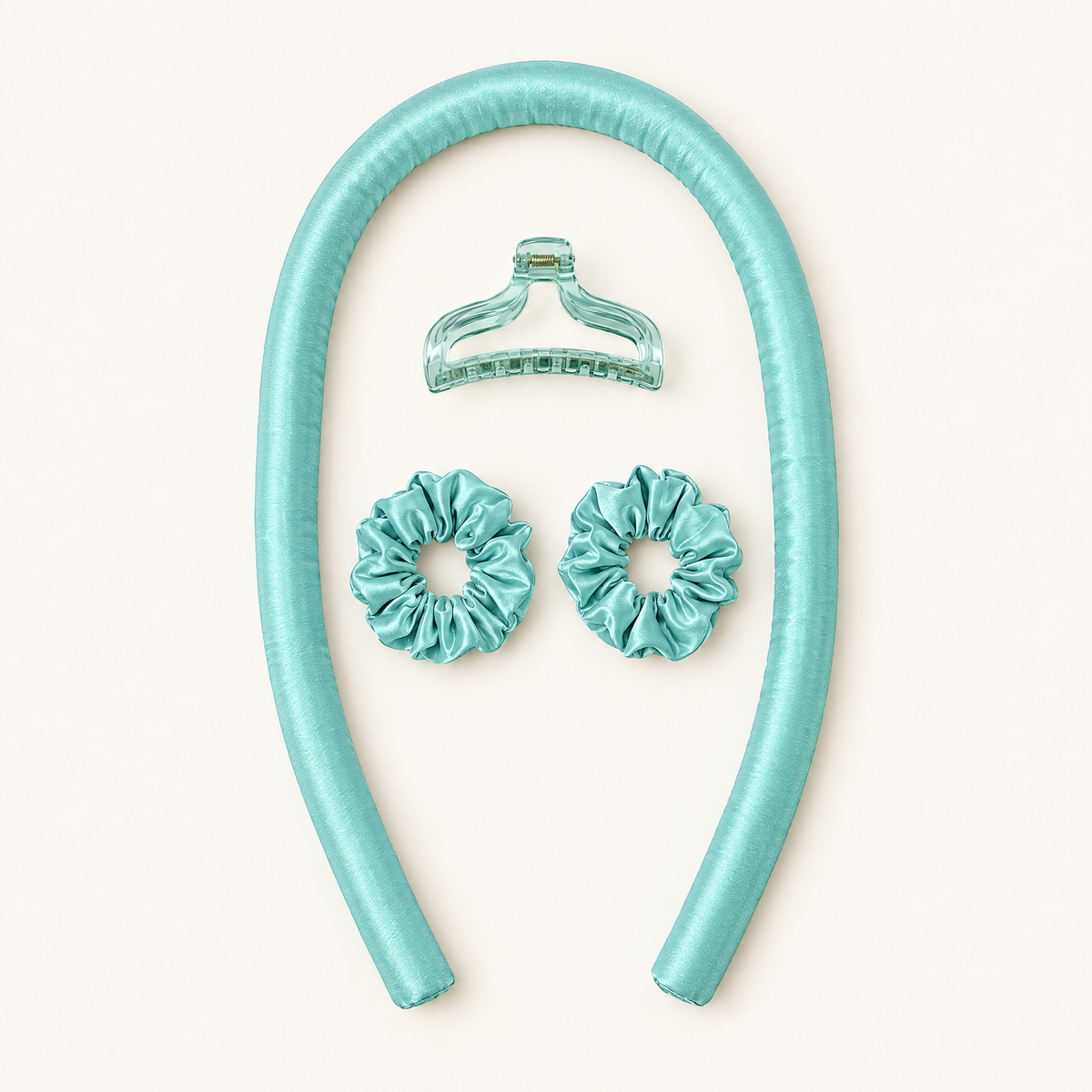 Complete mint curling kit laid out with one rod, two scrunchies and one claw clip